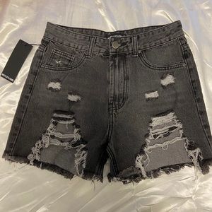 Women’s black distressed denim shorts